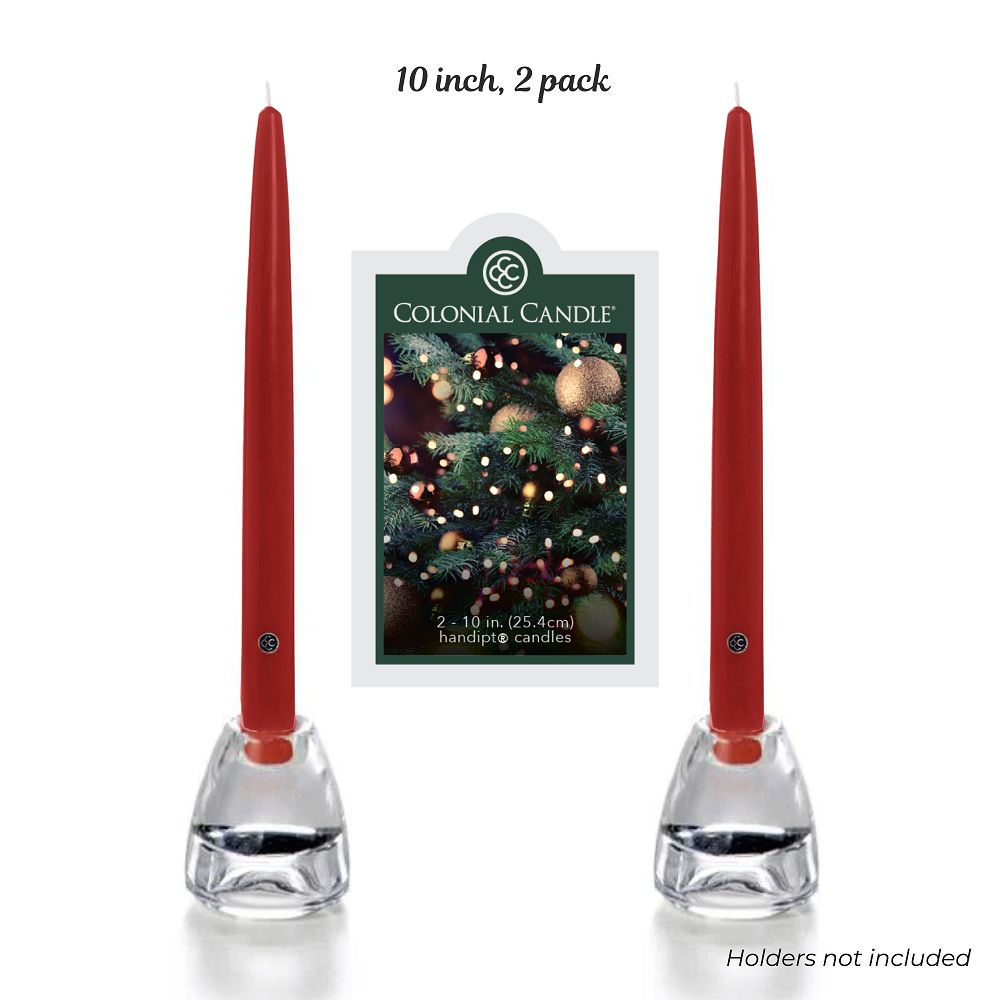 Two red candles in clear holders with a Colonial Candle packaging in the background on a white background.