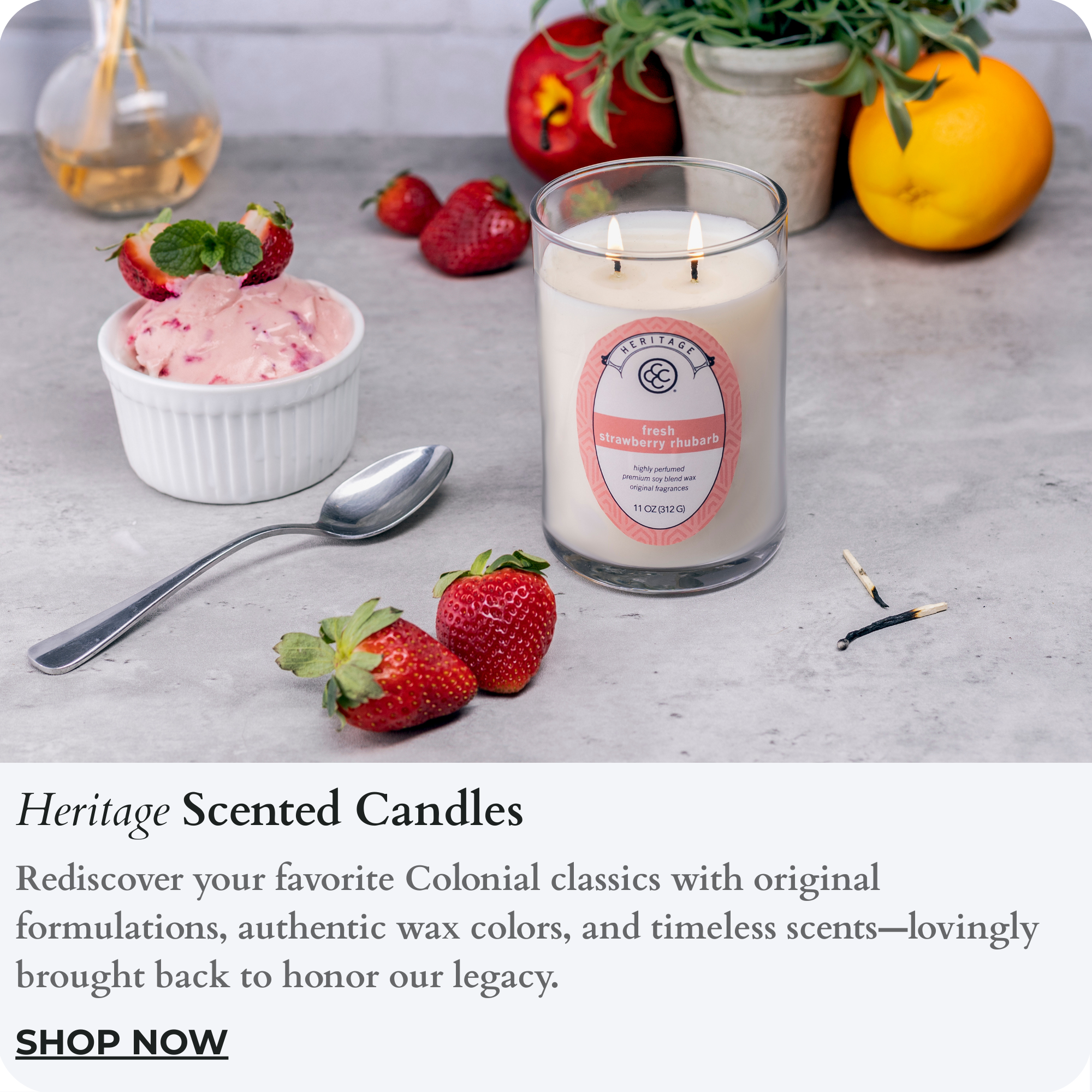 Heritage scents in a cylindrical jar collection candle representative image. Shows strawberry candle. It is a clickable photo. Clicking takes one to the collection page