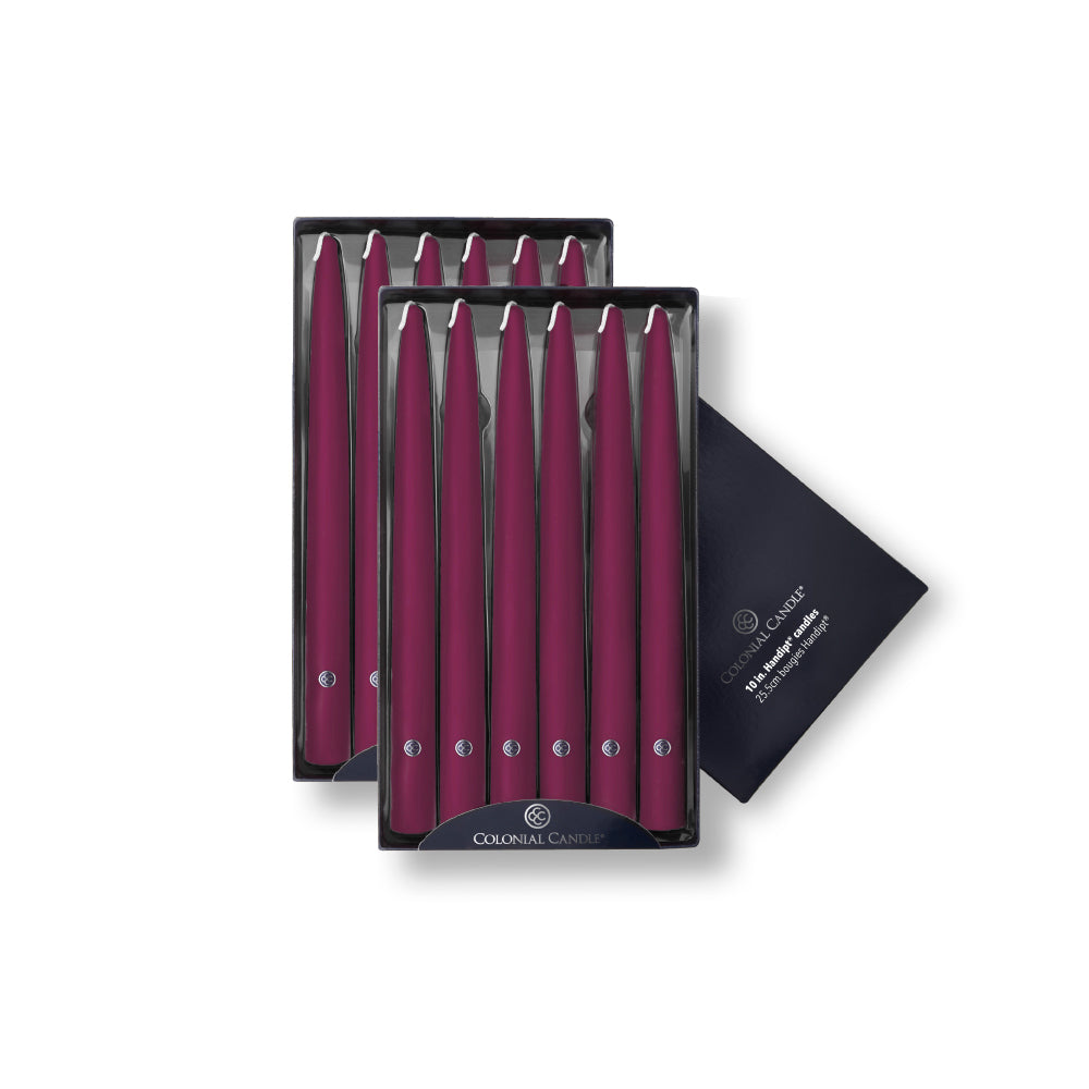 A set of mulberry colored unscented taper candles packaged in a box, with the brand Colonial Candle visible.