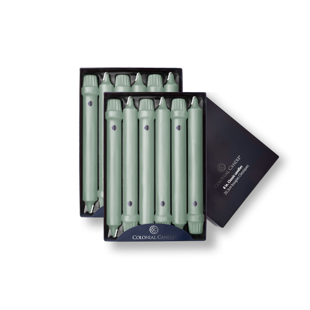 A pack of eight Colonial Green Classic taper candles presented in a black box with the Colonial Candle brand visible.