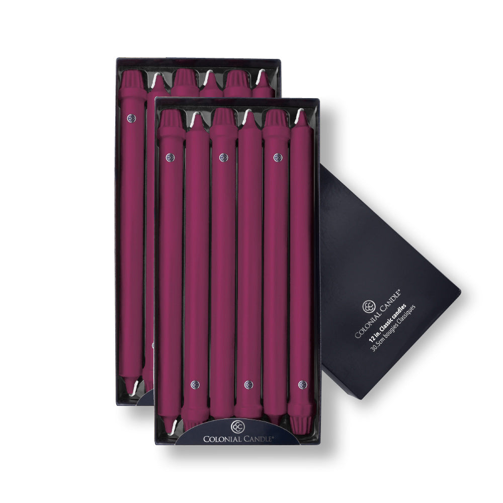 A pack of twelve unscented mulberry taper candles with beveled bases, presented in a box with a Colonial blue interior.
