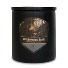 Black candle jar with 'Wilderness Trail' label featuring a forest design.